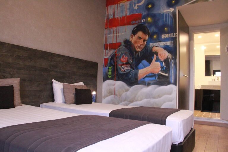 Tom Cruise as Maverick from Top Gun themed room 208 at Rise Street Art Hotel.