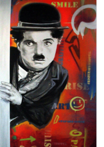 Charlie Chaplin mural with vibrant background at Rise Street Art Hotel's common area