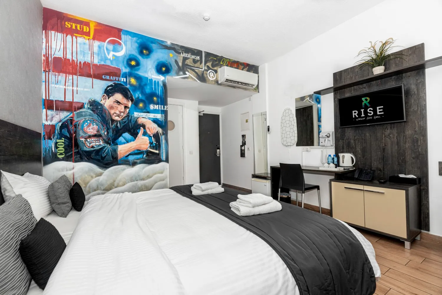 Top Gun-themed hotel room with Tom Cruise mural