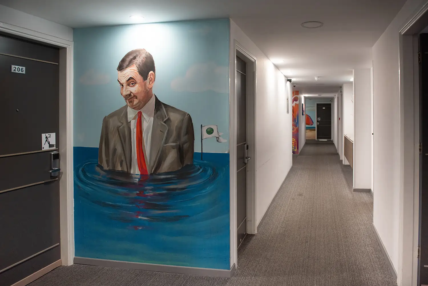 Mr. Bean-themed mural in a hotel hallway