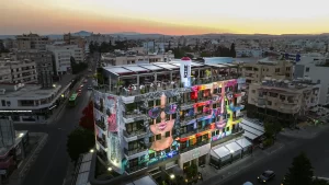 Rise Hotel building exterior at sunset