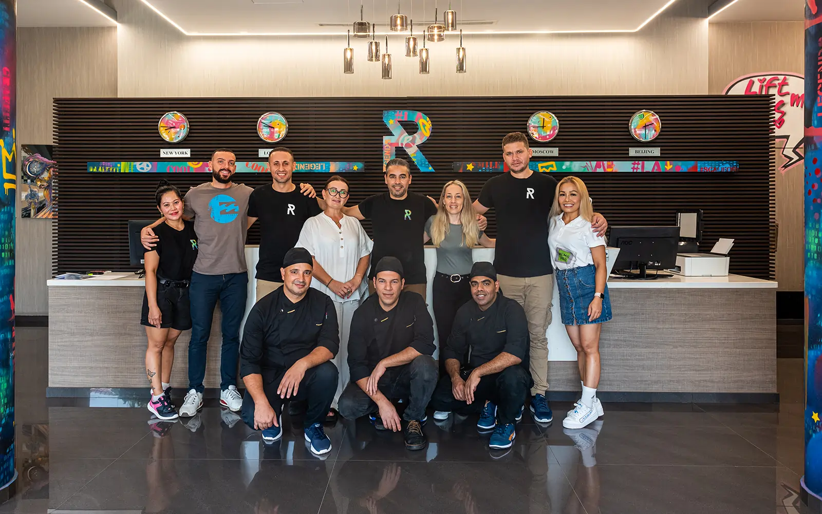 Hotel staff posing at the reception area