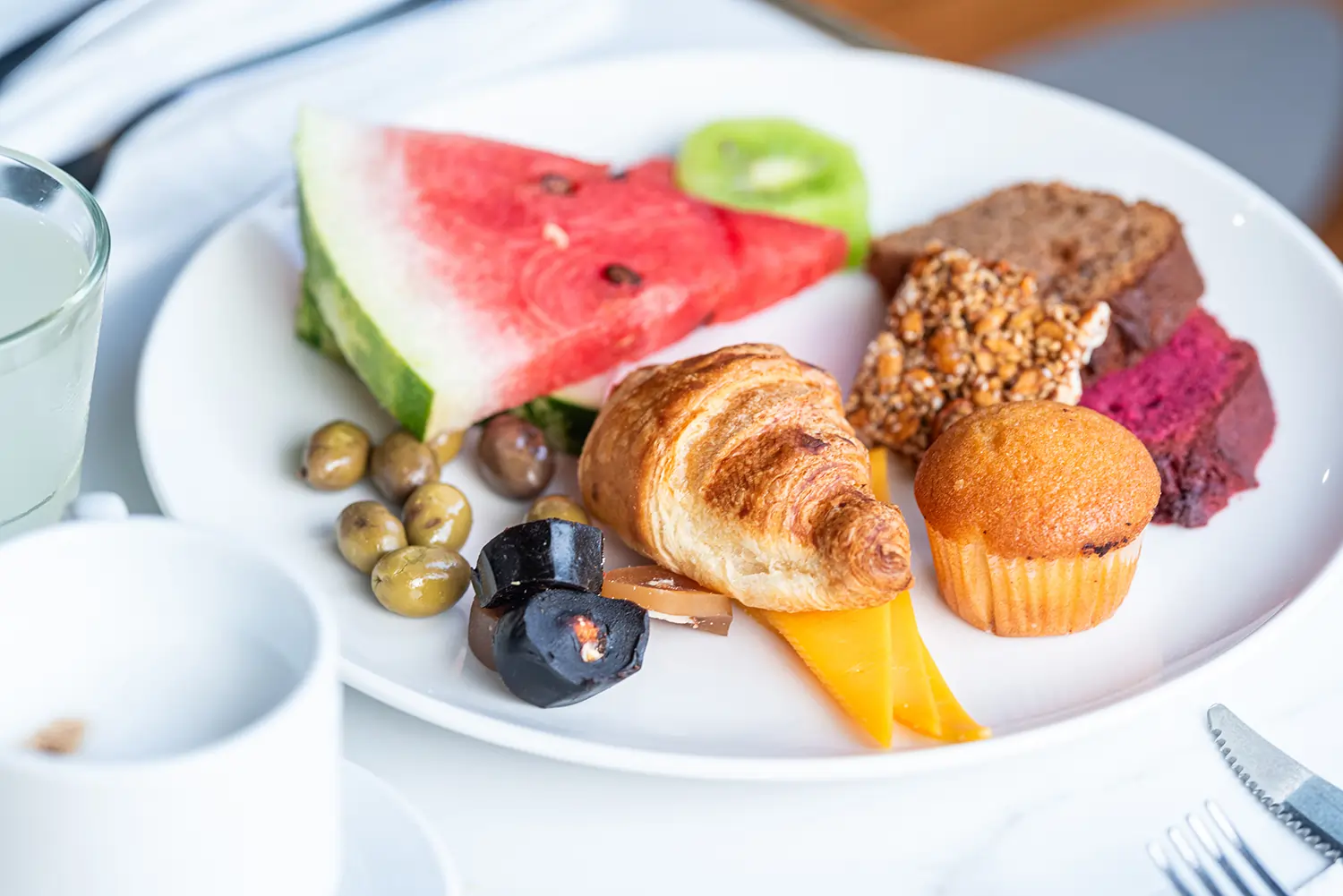 Healthy Breakfast Plate with Fruits and Pastries