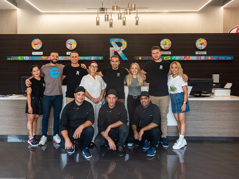 Hotel staff posing at the reception area