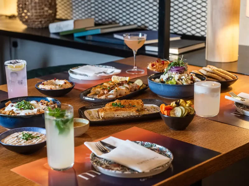 table full of dishes memories rooftop larnaca rise urban art hotel