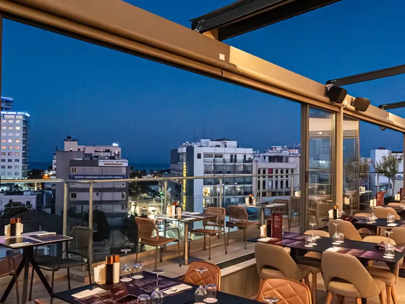 Spacious rooftop dining terrace at Memories Rooftop Restaurant featuring indoor and outdoor seating areas